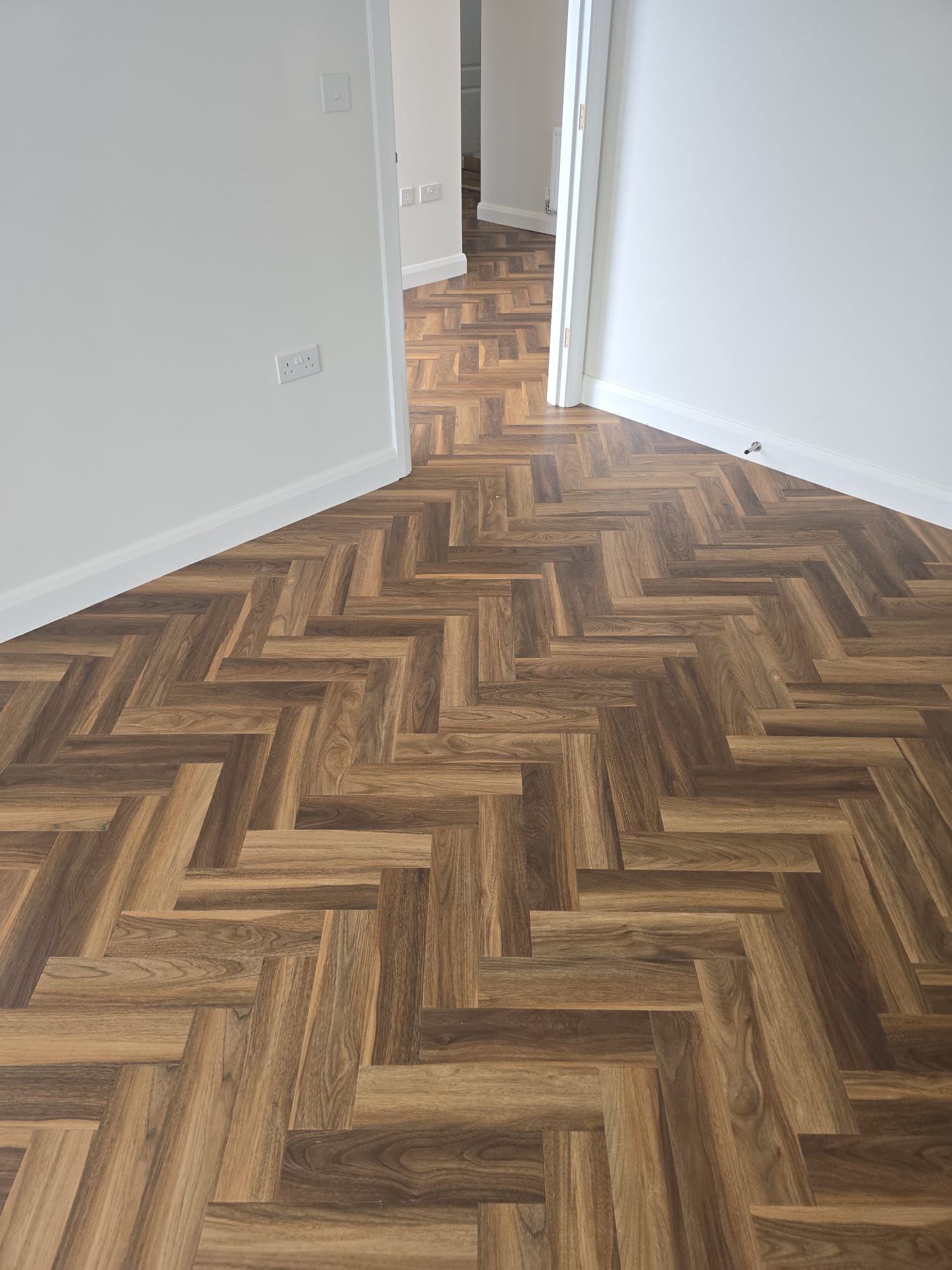 Textures LVT Herringbone colour Warm Walnut supplied & fitted in Tytherington 1