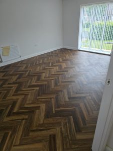 Textures LVT Fitted Herringbone style in the colour Warm Walnut 