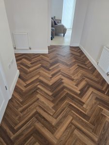 Textures LVT Fitted Herringbone style in the colour Warm Walnut in a beautiful home In Tytherington